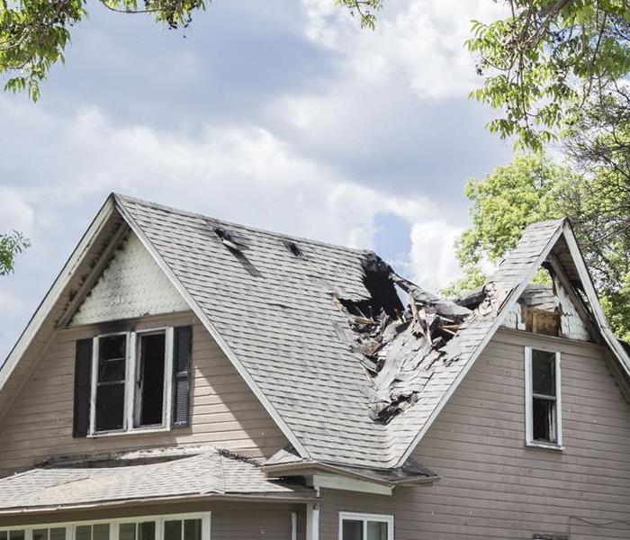 Roof of a house burned and caved in